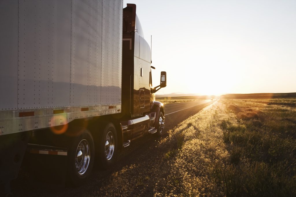 side-view-of-a-trailer-and-truck-on-the-road-at-su-2023-11-27-05-31-51-utc-min